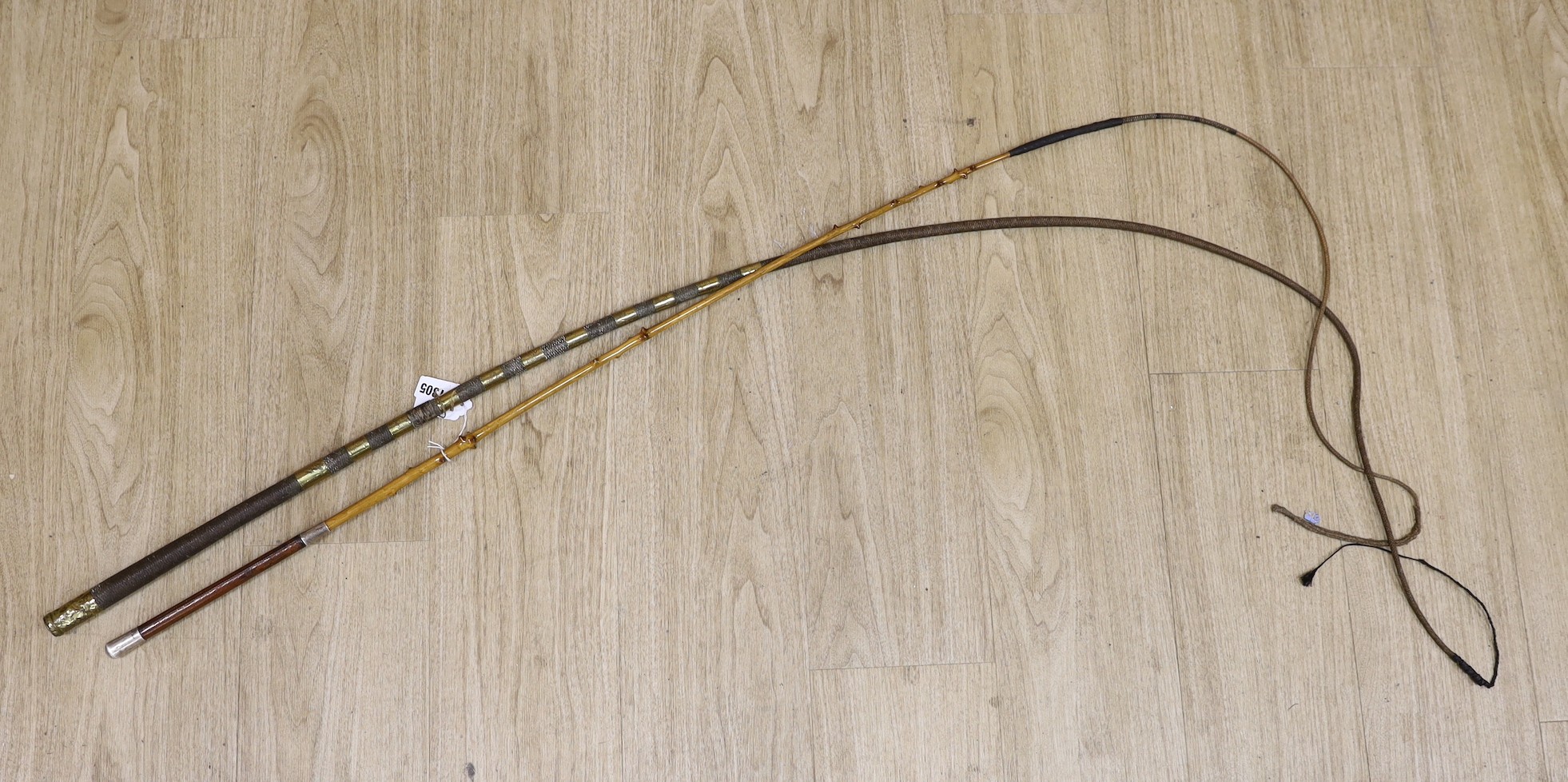 A silver mounted leather handled whip and another brass bound whip